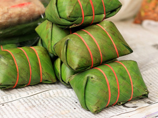 Sausage in banana leaves.