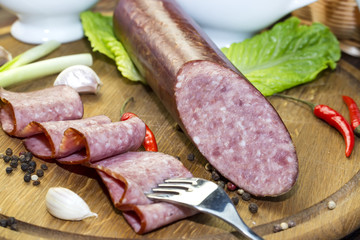sausage on a wooden plate in a restaurant