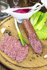 sausage on a wooden plate in a restaurant