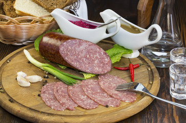 sausage on a wooden plate in a restaurant