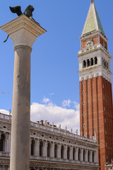 Fototapeta na wymiar Lion of St Mark and St Mark's Campanile is the bell tower of St