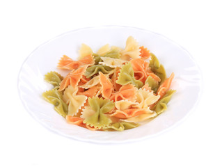 colored farfalle on white plate