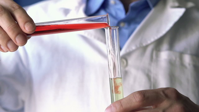 Chemist Mixing Chemicals In Test Tubes, Super Slow Motion