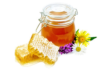 Honeycomb with a jar and flowers