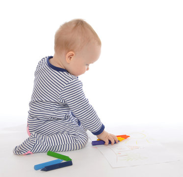 Child baby toddler sitting drawing painting with colour pencils