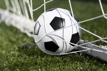 Photo sur Plexiglas Sports de balle Soccer ball and goal net