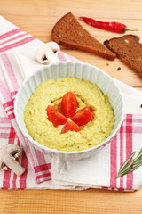 Bowl of tasty fresh hummus, close up