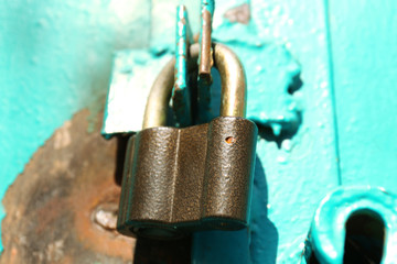 Old padlock on door, close up