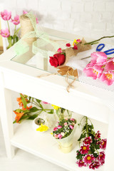 Working place of florist. On light background. Conceptual photo