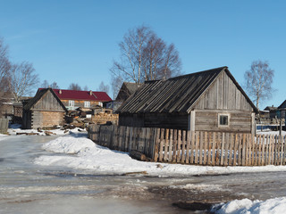 Wooden house in winter village