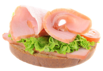 Delicious sandwich with lettuce and ham isolated on white