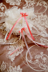 Beautiful lace wedding garter with a bow.