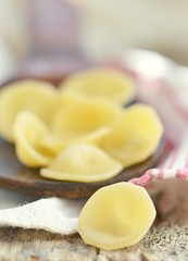 dry pasta on wooden table
