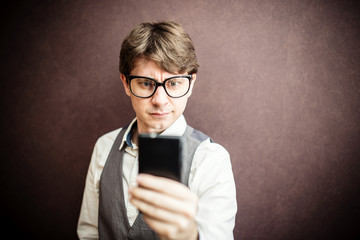 Funny guy using mobile smartphone