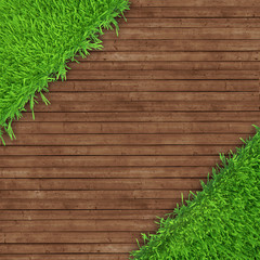 green grass over wood background