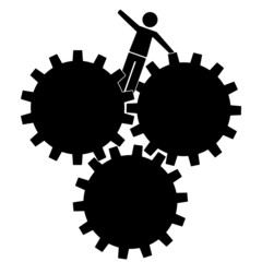 Mann zwischen Zahnrädern