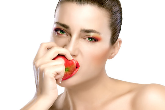Beautiful Brunette Girl Biting an Apple