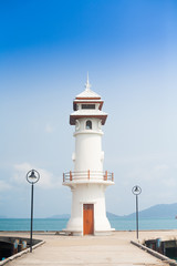Fototapeta na wymiar Lighthouse at the sea pier