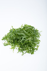 Heap of ruccola leaves isolated on white background