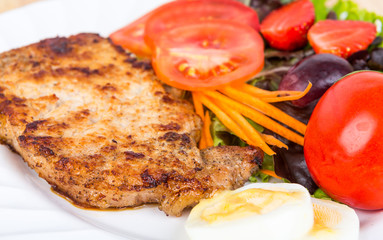 Grilled beef steak with salad