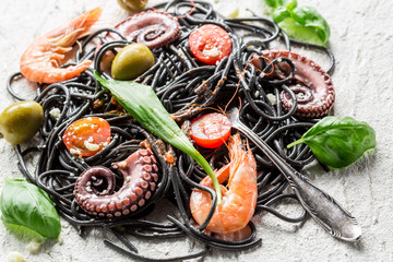 Black spaghetti with seafood and vegetables