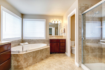 Modern bathroom with round tub and shower