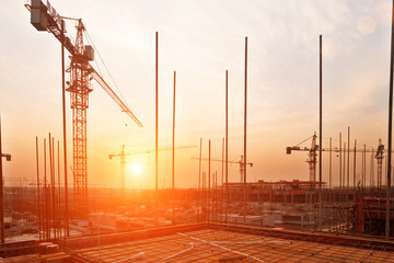 buildings under construction with sunset