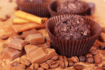 Delicious chocolates on table close-up