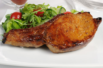 Grilled steak with vegetables on bone