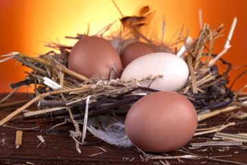 Healthy domestic eggs in a nest of straw