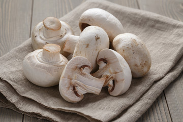 fresh white champignon on wood table