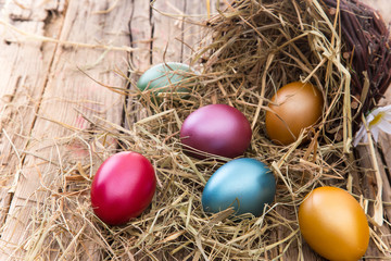 Fototapeta na wymiar Easter eggs on wooden background