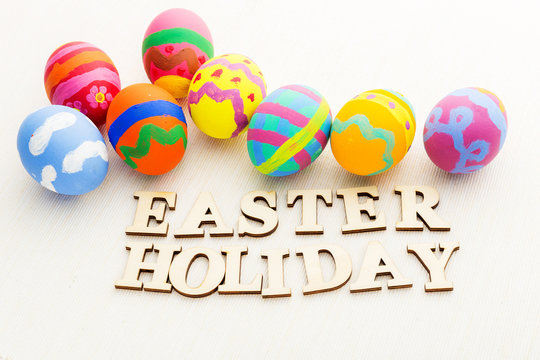 Colourful easter egg with wooden text