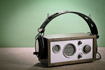 modern radio and headphones retro style,  mint green background,