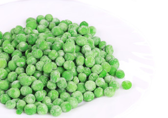 Close up of frozen green peas.