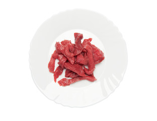 raw meat on a plate over white background. clipping path