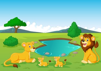 Fototapeta premium Cartoon lion family near watering hole