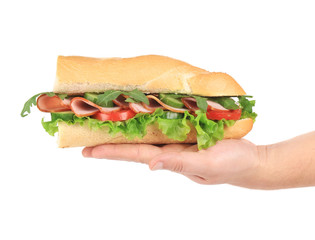 Baguette sandwich in hand.