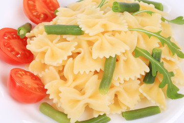 Pasta with tomatoes and french beans.