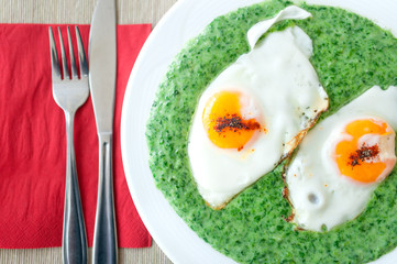 spinach with spicy eggs at breakfast