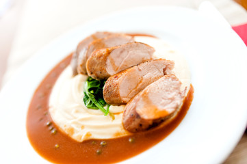 Mashed potatoes with grilled pork as main course