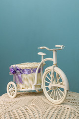 Fototapeta na wymiar The bike with a basket on a blue background