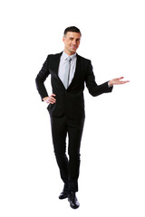 Business man presenting over a white background