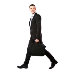Businessman walking with laptop bag 