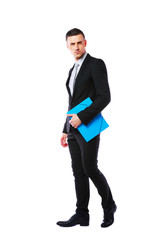 businessman standing with blue folder over white background