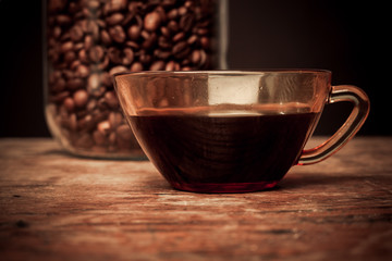 Cup of coffee and jar of beans