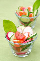 salad of fresh vegetables in portioned glasses