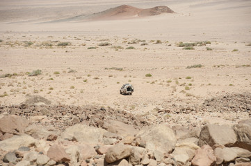 Off-road vehicle parked in an arid desert