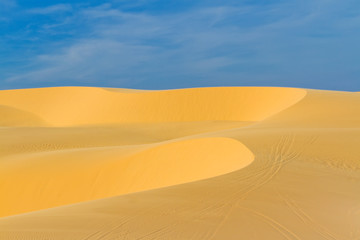Fototapeta na wymiar Sand dunes against blue sky 