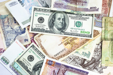 a collection of various currencies from countries the globe